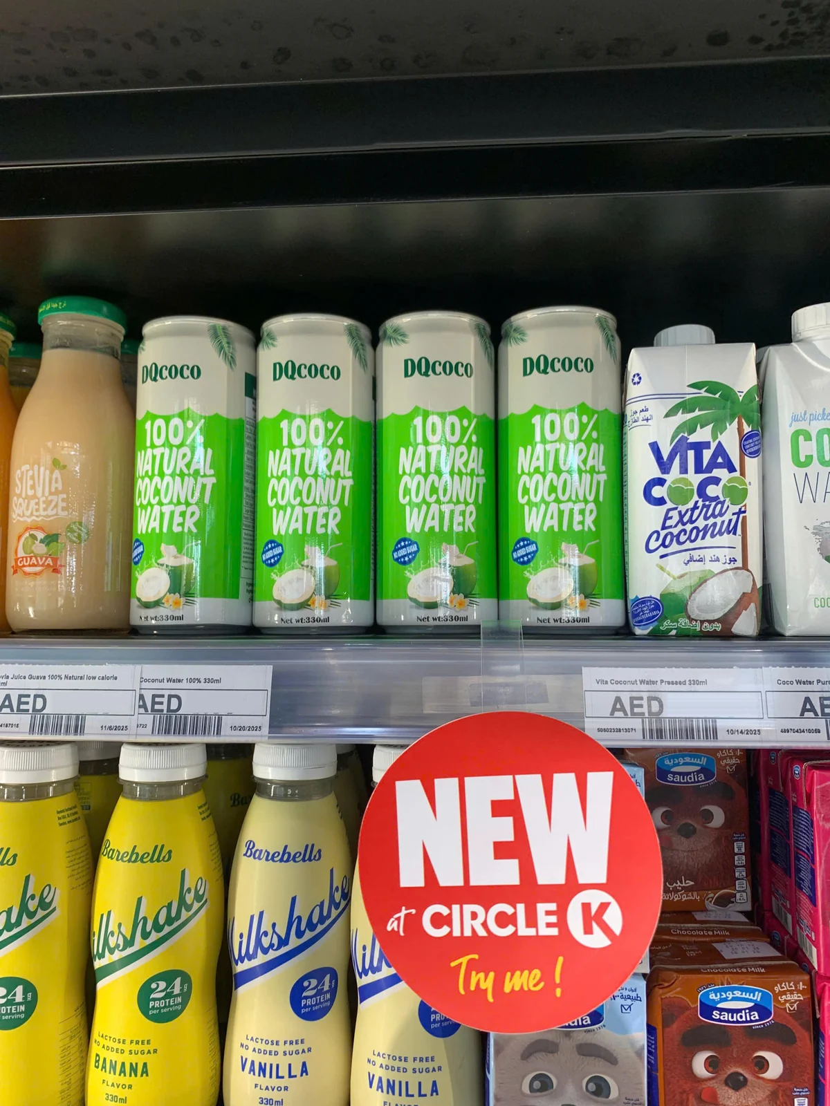 DQ Agri 100% natural coconut water on a chilled retail shelf in Dubai, UAE, priced in AED